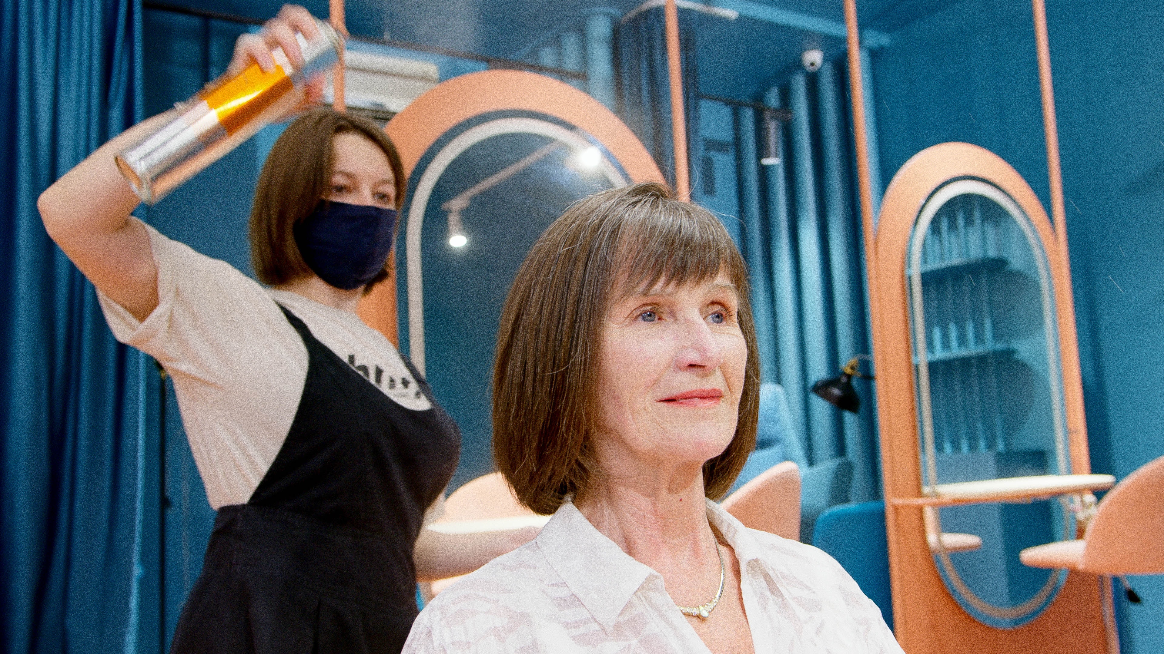 A hairdresser with a client